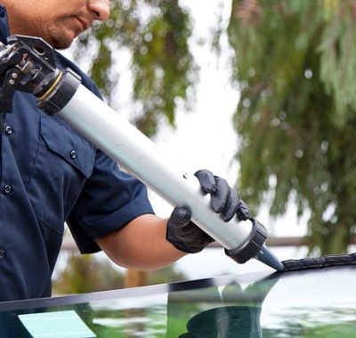 replacing fixed roof glass applying adhesive on fixed roof glass